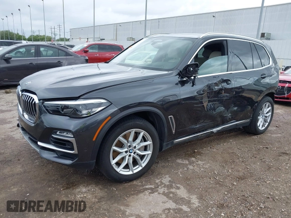 2021 BMW X5 xDrive45e with VIN 5UXTA6C02M9F88978, listed as a IAAI auction lot 42201563 with 23,339 mi miles and . Bid and sale history available at DreamBid. Image 2.