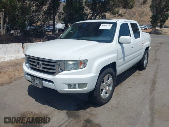 2012 Honda Ridgeline RTL z VIN 5FPYK1F57CB455267, wystawiony jako IAAI lot #42462296 z przebiegiem 186 451 mil mil oraz . Historia ofert i sprzedaży dostępna na DreamBid. Obrazek 17.