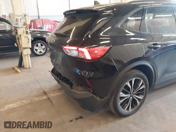 2021 Ford Escape SEL with VIN 1FMCU9H91MUA05128, listed as a IAAI auction lot 42073118 with 57,373 mi miles and . Bid and sale history available at DreamBid. Image 6.