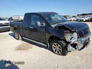 2006 Nissan Titan SE with VIN 1N6BA06B96N521452, listed as a Copart auction lot 70101084 with 197,101 mi miles and Salvage Title. Bid and sale history available at DreamBid. Image 4.