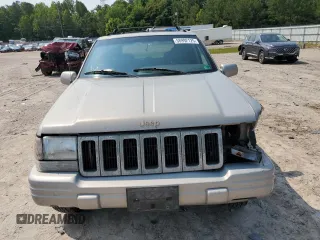 1998 Jeep Grand Cherokee Limited with VIN 1J4GZ78Y5WC324828, listed as a Copart auction lot 58992125 with 225,705 mi miles and Salvage title. Bid and sale history available at DreamBid. Image 5.