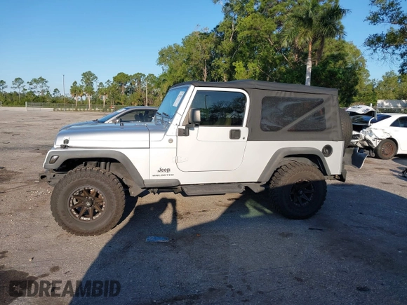 2005 Jeep Wrangler Unlimited with VIN 1J4FA44S65P335444, listed as a IAAI auction lot 41731093 with 143,918 mi miles. Bid and sale history available at carsss.com. Image 14.
