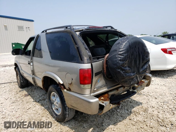 2000 Chevrolet Blazer LS z VIN 1GNCT18W3YK175871, wystawiony jako Copart lot #58230204 z przebiegiem Nie podano mil oraz Nie do naprawy • Non repairable. Historia ofert i sprzedaży dostępna na DreamBid. Obrazek 2.