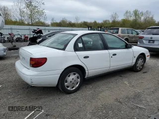 2002 Saturn SL z VIN 1G8ZH52842Z303274, wystawiony jako Copart lot #55164235 z przebiegiem 123 177 mil mil oraz Tytuł czysty. Historia ofert i sprzedaży dostępna na DreamBid. Obrazek 3.