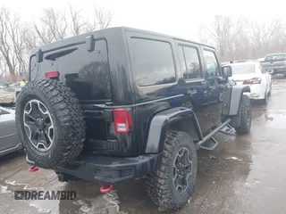 2015 Jeep Wrangler Unlimited Rubicon Hard Rock with VIN 1C4HJWFG9FL569962, listed as a IAAI auction lot 41557801 with 78,597 mi miles and . Bid and sale history available at DreamBid. Image 4.