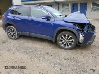 2022 Toyota Corolla Cross XLE with VIN 7MUDAABGXNV042443, listed as a Copart auction lot 57808565 with 102,887 mi miles and Salvage title. Bid and sale history available at DreamBid. Image 4.