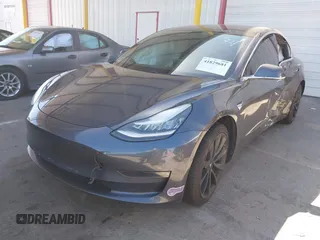 2018 Tesla Model 3 Long Range Battery with VIN 5YJ3E1EA7JF163401, listed as a IAAI auction lot 41829681 with 90,065 mi miles. Bid and sale history available at carsss.com. Image 2.