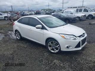 2014 Ford Focus Titanium with VIN 1FADP3J27EL142095, listed as a IAAI auction lot 42004419 with 139,515 mi miles. Bid and sale history available at carsss.com. Image 1.