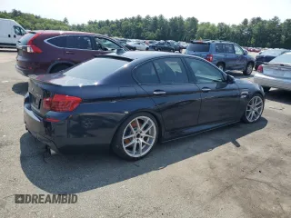 2016 BMW 5 Series 550i xDrive with VIN WBAKP9C52GG587591, listed as a Copart auction lot 58402505 with 94,384 mi miles and Salvage title. Bid and sale history available at DreamBid. Image 3.