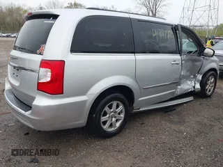 2012 Chrysler Town & Country Touring with VIN 2C4RC1BGXCR213014, listed as a IAAI auction lot 41997723 with 143,848 mi miles. Bid and sale history available at carsss.com. Image 4.