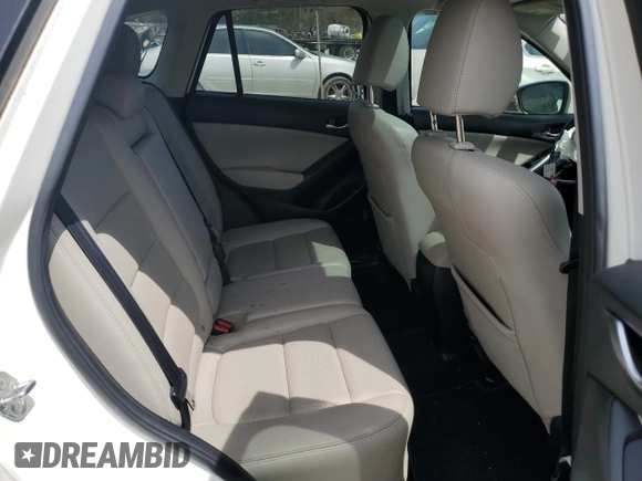 2015 Mazda CX-5 Grand Touring with VIN JM3KE4DY0F0458719, listed as a Copart auction lot 52960365 with 128,372 mi miles and Salvage Title. Bid and sale history available at DreamBid. Image 11.