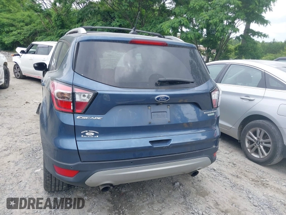 2018 Ford Escape Titanium with VIN 1FMCU0J99JUA12717, listed as a IAAI auction lot 42237509 with 123,896 mi miles and . Bid and sale history available at DreamBid. Image 16.
