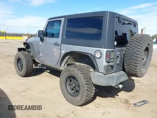 2014 Jeep Wrangler Sport with VIN 1C4AJWAG5EL206565, listed as a IAAI auction lot 42015000 with 90,129 mi miles and . Bid and sale history available at carsss.com. Image 3.