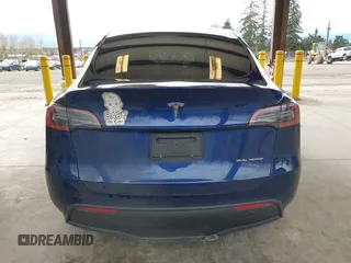 2023 Tesla Model Y Long Range with VIN 7SAYGDEEXPF621397, listed as a IAAI auction lot 41922714 with 29,460 mi miles. Bid and sale history available at carsss.com. Image 16.