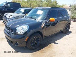2015 MINI Countryman S with VIN WMWZC3C5XFWT02566, listed as a IAAI auction lot 42408045 with 114,822 mi miles and . Bid and sale history available at DreamBid. Image 2.