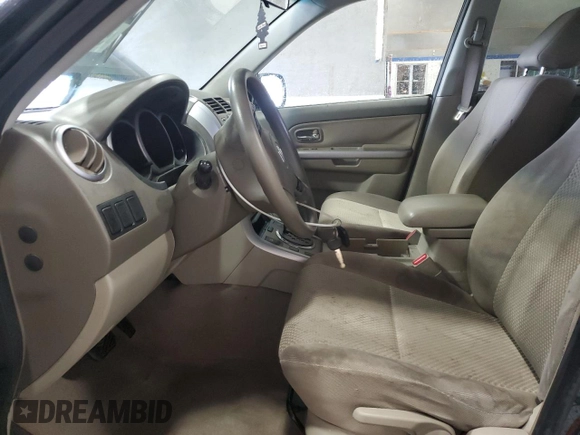 2009 Suzuki Grand Vitara with VIN JS3TE042694100010, listed as a Copart auction lot 56716225 with 148,495 mi miles and Salvage title. Bid and sale history available at DreamBid. Image 7.