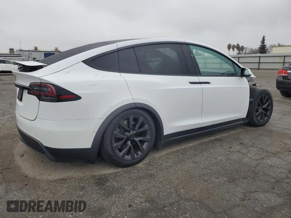 2023 Tesla Model X with VIN 7SAXCAE58PF379943, listed as a Copart auction lot 86352354 with Not Provided miles and Salvage Title. Bid and sale history available at DreamBid. Image 3.