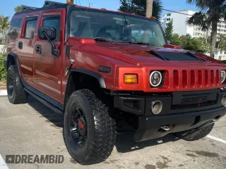 2003 Hummer H2 with VIN 5GRGN23U73H149133, listed as a Copart auction lot 52819745 with 104,769 mi miles and Salvage Title. Bid and sale history available at carsss.com. Image 1.