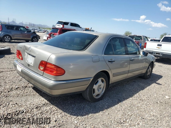 1997 Mercedes-Benz E-Class with VIN WDBJF72F2VA274233, listed as a Copart auction lot 74123554 with 80,914 mi miles and Salvage Title. Bid and sale history available at carsss.com. Image 3.