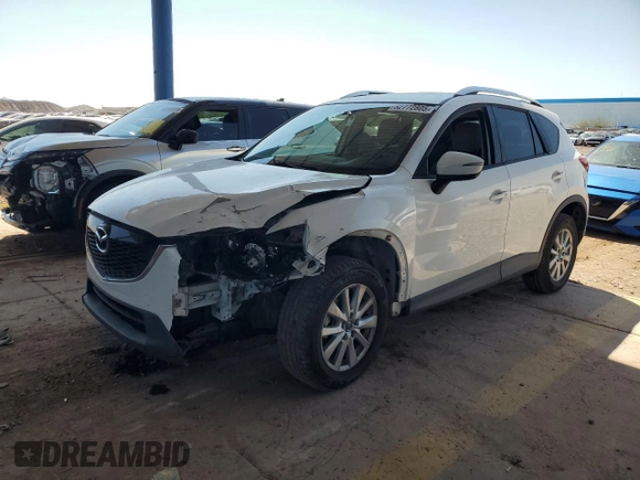 2015 Mazda CX-5 Touring with VIN JM3KE2CY2F0478167, listed as a Copart auction lot 52772805 with 135,492 mi miles and Salvage Title. Bid and sale history available at carsss.com. Image 1.
