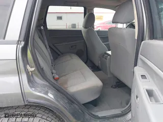 2007 Jeep Grand Cherokee Laredo with VIN 1J8GR48K57C556517, listed as a IAAI auction lot 41534166 with 158,914 mi miles. Bid and sale history available at carsss.com. Image 8.