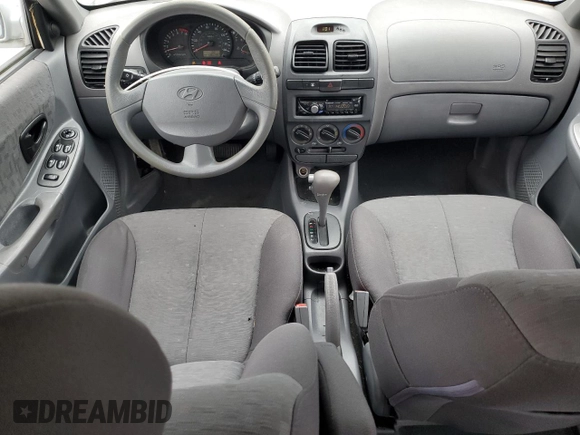 2005 Hyundai Accent GLS z VIN KMHCG45C75U639281, wystawiony jako Copart lot #54887095 z przebiegiem 136 090 mil mil oraz Szkoda całkowita • Salvage title. Historia ofert i sprzedaży dostępna na DreamBid. Obrazek 8.