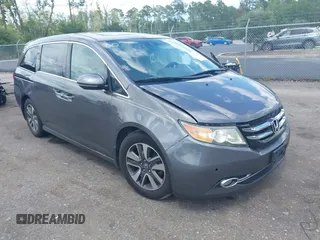 2015 Honda Odyssey Touring Elite with VIN 5FNRL5H92FB032487, listed as a IAAI auction lot 42729705 with 128,934 mi miles and . Bid and sale history available at DreamBid. Image 1.