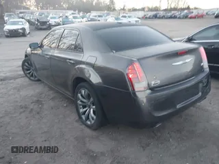 2014 Chrysler 300 S with VIN 2C3CCABG2EH352220, listed as a IAAI auction lot 41796284 with 127,070 mi miles and . Bid and sale history available at DreamBid. Image 3.