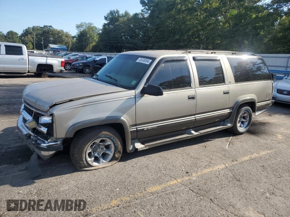 1999 Chevrolet Suburban with VIN 1GNEC16R9XJ490863, listed as a Copart auction lot 65938594 with 176,391 mi miles and Salvage Title. Bid and sale history available at carsss.com. Image 1.