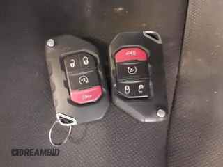 2020 Jeep Wrangler Unlimited Sport Altitude с VIN 1C4HJXDG4LW120627, выставлен на аукционе IAAI как лот 41728593 с пробегом 63 565 миль миль и . История ставок и продаж доступна на DreamBid. Изображение 11.