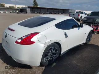 2016 Nissan 370Z Sport z VIN JN1AZ4EH9GM931683, wystawiony jako IAAI lot #42000779 z przebiegiem 113 919 mil mil oraz . Historia ofert i sprzedaży dostępna na DreamBid. Obrazek 4.