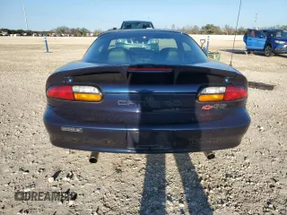 2000 Chevrolet Camaro Z28 z VIN 2G1FP22G3Y2123001, wystawiony jako Copart lot #85730994 z przebiegiem 32 579 mil mil oraz Szkoda całkowita • Salvage title. Historia ofert i sprzedaży dostępna na DreamBid. Obrazek 6.