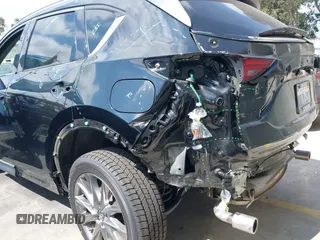 2020 Mazda CX-5 Grand Touring with VIN JM3KFADM3L1819939, listed as a IAAI auction lot 42749920 with 35,407 mi miles and . Bid and sale history available at DreamBid. Image 6.