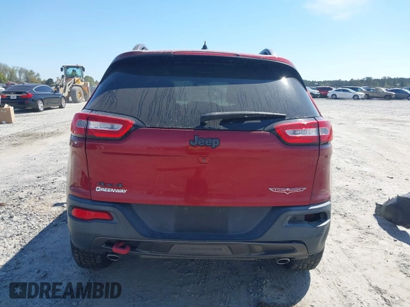 2015 Jeep Cherokee Trailhawk with VIN 1C4PJMBS1FW640483, listed as a IAAI auction lot 41883688 with 103,589 mi miles. Bid and sale history available at carsss.com. Image 16.