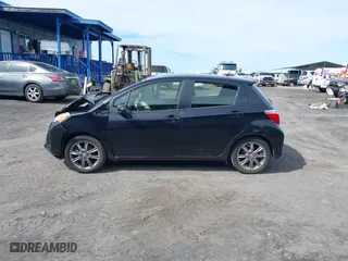 2012 Toyota Yaris L with VIN JTDKTUD35CD529596, listed as a IAAI auction lot 41439354 with 87,493 mi miles. Bid and sale history available at carsss.com. Image 14.