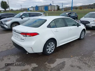 2023 Toyota Corolla Hybrid LE with VIN JTDBCMFE2P3007101, listed as a IAAI auction lot 40799086 with 13,974 mi miles. Bid and sale history available at carsss.com. Image 4.