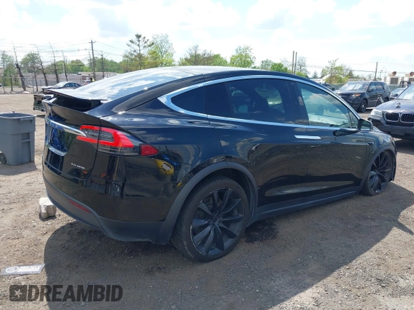 2019 Tesla Model X 75D with VIN 5YJXCBE21KF180203, listed as a IAAI auction lot 42190255 with 114,294 mi miles and . Bid and sale history available at DreamBid. Image 4.