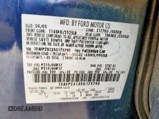 2005 Ford Five Hundred SE z VIN 1FAFP23135G175790, wystawiony jako Copart lot #56588085 z przebiegiem 117 354 mil mil oraz Szkody całkowita. Historia ofert i sprzedaży dostępna na DreamBid. Obrazek 12.