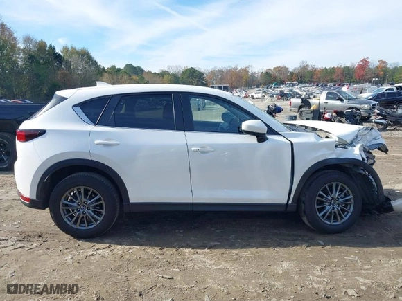 2021 Mazda CX-5 Touring with VIN JM3KFACMXM0445239, listed as a IAAI auction lot 40977629 with NaN miles. Bid and sale history available at carsss.com. Image 14.