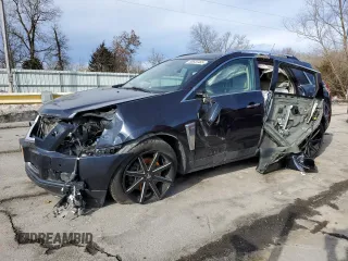 2014 Cadillac SRX Performance Collection z VIN 3GYFNFE35ES608835, wystawiony jako Copart lot #88655465 z przebiegiem 130 114 mil mil oraz Szkoda całkowita • Salvage title. Historia ofert i sprzedaży dostępna na DreamBid. Obrazek 1.