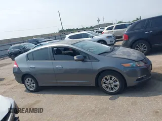2010 Honda Insight EX with VIN JHMZE2H71AS043465, listed as a IAAI auction lot 42312556 with 151,009 mi miles and . Bid and sale history available at DreamBid. Image 13.