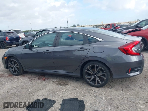 2019 Honda Civic Sport with VIN 2HGFC2F89KH563333, listed as a IAAI auction lot 41959217 with 66,068 mi miles and . Bid and sale history available at DreamBid. Image 14.