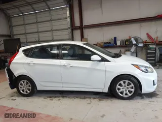 2013 Hyundai Accent GL with VIN KMHCT5AE6DU122559, listed as a IAAI auction lot 41800714 with 129,582 mi miles. Bid and sale history available at carsss.com. Image 13.