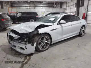 2014 BMW 6 Series 650i xDrive z VIN WBA6B4C55ED371378, wystawiony jako IAAI lot #41640888 z przebiegiem 80 927 mil mil oraz . Historia ofert i sprzedaży dostępna na DreamBid. Obrazek 17.