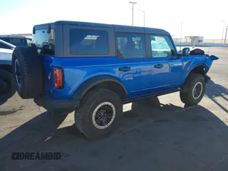 2022 Ford Bronco z VIN 1FMEE5DPXNLB37346, wystawiony jako IAAI lot #41346731 z przebiegiem 20 709 mil mil oraz . Historia ofert i sprzedaży dostępna na DreamBid. Obrazek 4.