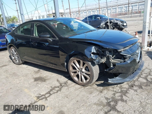2015 Mazda 6 i Grand Touring with VIN JM1GJ1W61F1165006, listed as a IAAI auction lot 41988778 with 113,226 mi miles and . Bid and sale history available at carsss.com. Image 1.