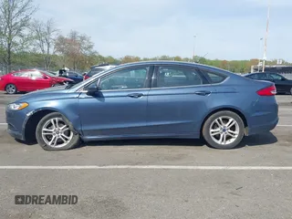 2018 Ford Fusion SE z VIN 3FA6P0H74JR176113, wystawiony jako IAAI lot #42074916 z przebiegiem 78 940 mil mil oraz . Historia ofert i sprzedaży dostępna na DreamBid. Obrazek 14.