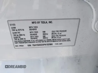 2023 Tesla Model Y Long Range with VIN 7SAYGDEEXPA152986, listed as a IAAI auction lot 41946665 with 13,574 mi miles and . Bid and sale history available at carsss.com. Image 9.