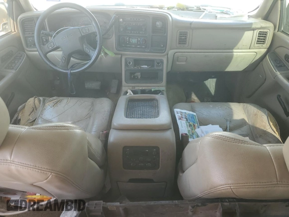2005 GMC Yukon SLT z VIN 1GKEC13T05J143724, wystawiony jako Copart lot #44611845 z przebiegiem 197 183 mil mil oraz Szkoda całkowita • Salvage title. Historia ofert i sprzedaży dostępna na DreamBid. Obrazek 8.