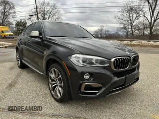 2016 BMW X6 xDrive50i with VIN 5UXKU6C5XG0R34277, listed as a Copart auction lot 48402165 with 103,762 mi miles and Clean Title. Bid and sale history available at carsss.com. Image 1.